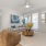 Apartments for Rent in Modesto, CA - Kinsley Yard - Living Room with Wood-Plank Flooring, Large Windows, and a Ceiling Fan