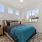 Three-Bedroom Apartments in Modesto, CA - Kinsley Yard - Bedroom with Spacious Windows, Ceiling Fan, and Nightstands