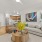 Modesto Apartments - Kinsley Yard - Living Room with Wood-Style Floors, Circle Coffee Table, and Open-Concept Floor Plan