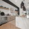Apartments in Modesto, CA - Kinsley Yard - Clubhouse with a Kitchenette, a Large Island with Seating, and a Coffee Station