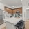 Modesto, CA Pet-Friendly Apartments - Kinsley Yard - Kitchen with Multi-Toned Cabinets, Modern Appliances, and a Large Kitchen Island