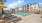 Pet-Friendly Apartments in Modesto, CA - Kinsley Yard - Pool with Yellow Umbrella Tables, Lounge Chairs, and Jacuzzi