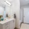 3-Bedroom Apartments in Modesto, CA - Kinsley Yard - Bathroom with a Tiled Shower, Quartz Countertops, and a Spacious Vanity